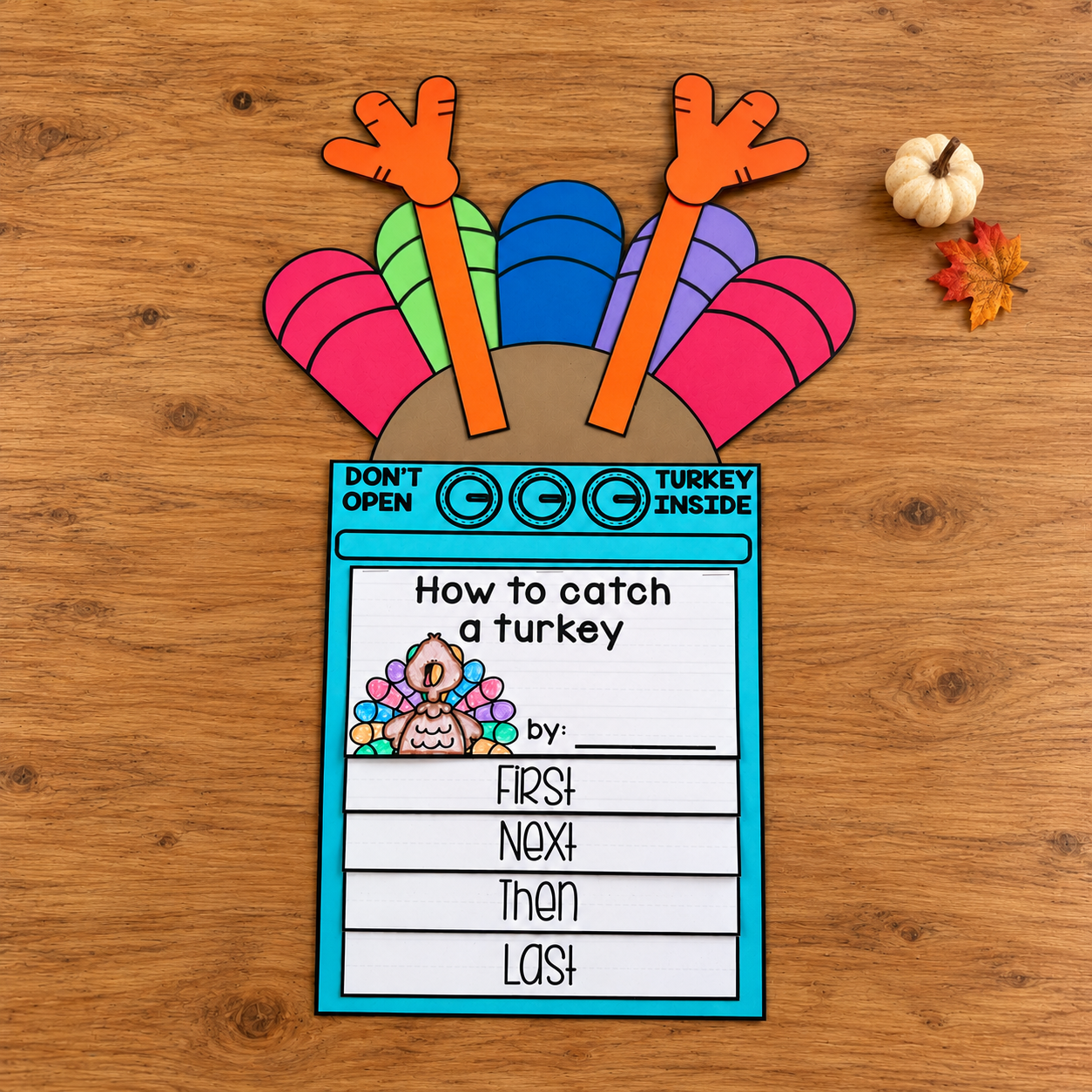 Colorful turkey craft with a blue oven base and a four-step How to Catch a Turkey flip book.
